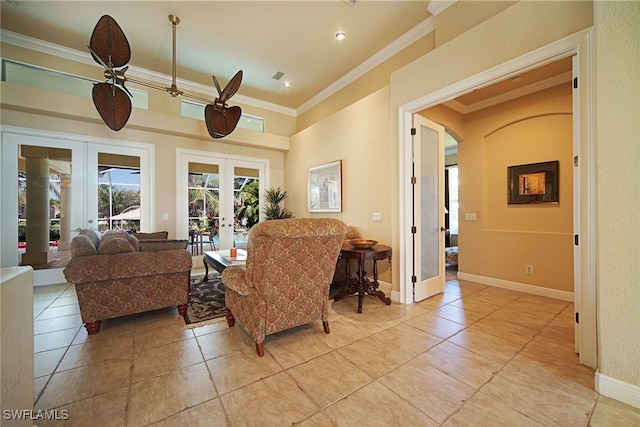 tiled living room with ceiling fan, french doors, and ornamental molding