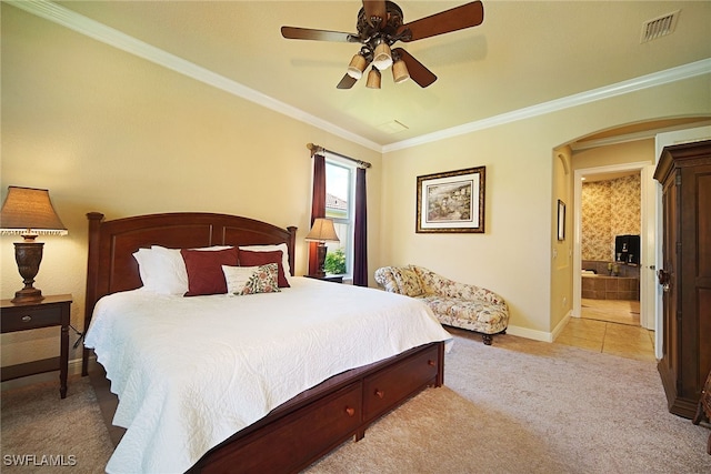 4126 SW 27th Ave, Cape Coral, FL 33914 - bedroom with light carpet, arched walkways, ornamental molding, baseboards, and ensuite bath