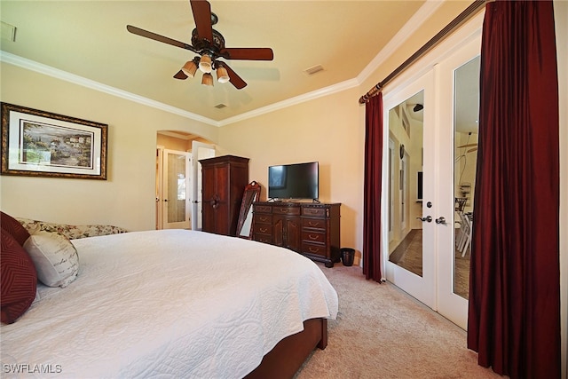 bedroom with french doors, light colored carpet, ceiling fan, and crown molding