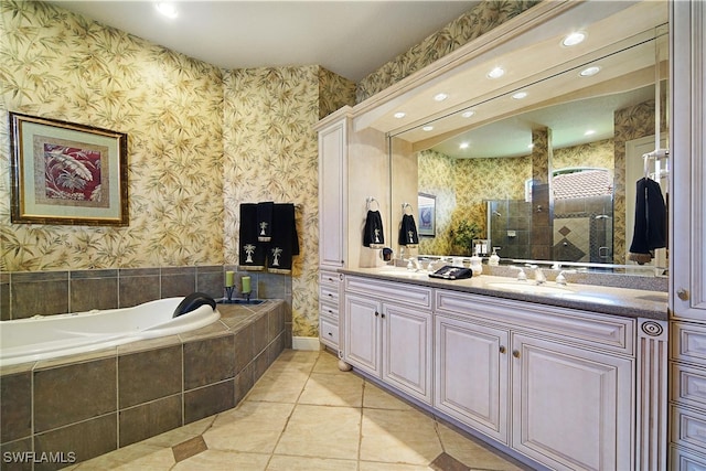 bathroom with tile patterned flooring, vanity, and independent shower and bath