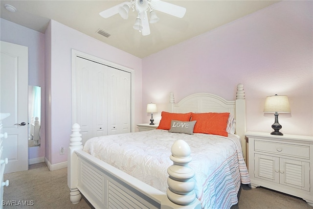 bedroom featuring ceiling fan, a closet, and light colored carpet