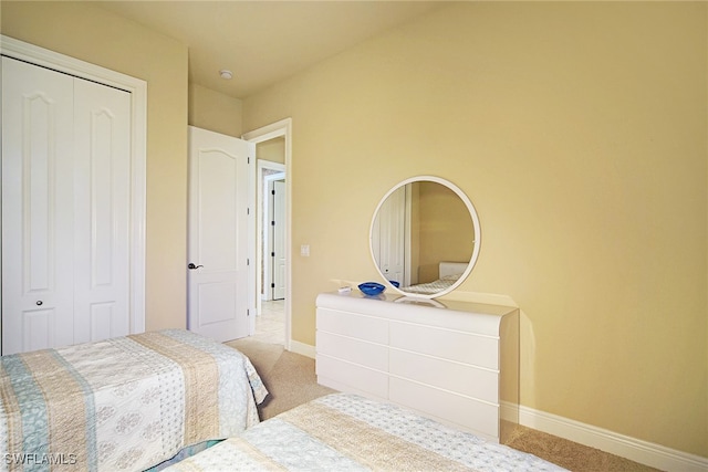 4126 SW 27th Ave, Cape Coral, FL 33914 - bedroom featuring light colored carpet, a closet, and baseboards