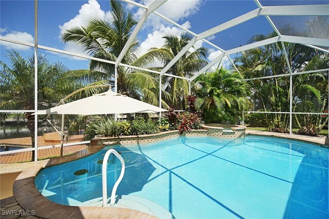 4126 SW 27th Ave, Cape Coral, FL 33914 - view of swimming pool featuring glass enclosure and a pool with connected hot tub