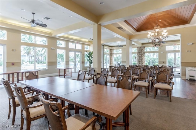 dining area with crown molding, beamed ceiling, ceiling fan with notable chandelier, and hardwood / wood-style flooring