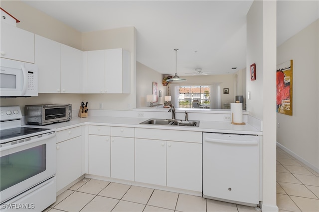 kitchen with ceiling fan, sink, light tile patterned floors, white appliances, and white cabinets