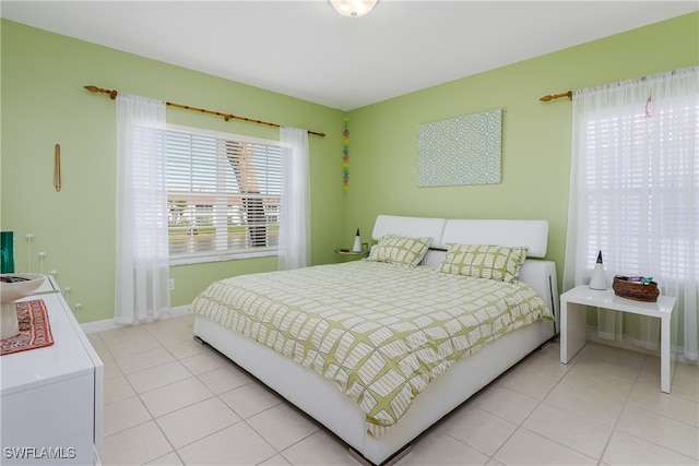 bedroom featuring light tile patterned flooring