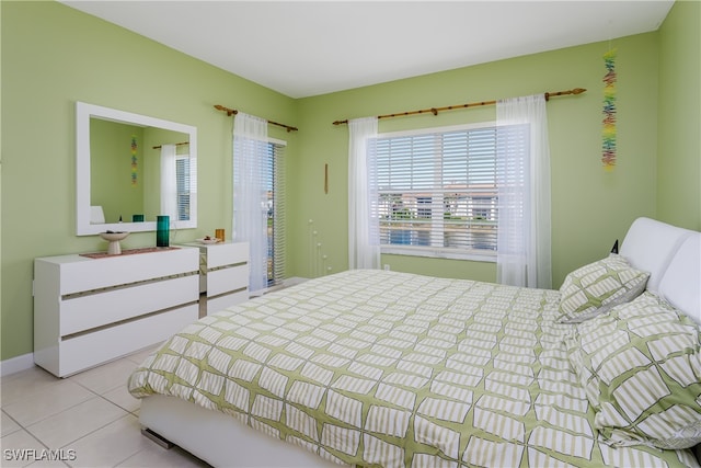 bedroom with light tile patterned floors