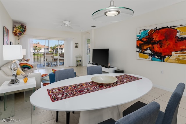 dining room featuring ceiling fan and light tile patterned floors