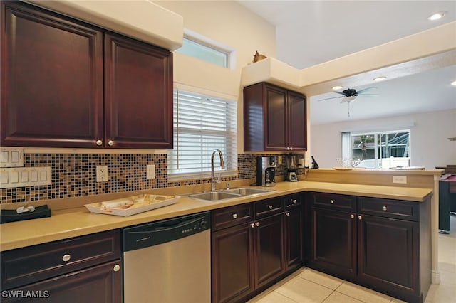 kitchen featuring kitchen peninsula, stainless steel dishwasher, ceiling fan, sink, and light tile patterned floors