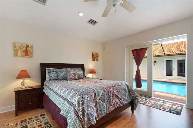 bedroom with hardwood / wood-style flooring, ceiling fan, and access to outside