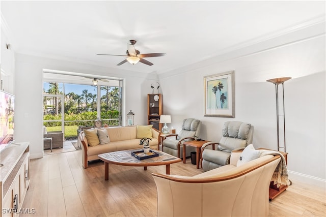 living room with light wood-type flooring, ceiling fan, and crown molding