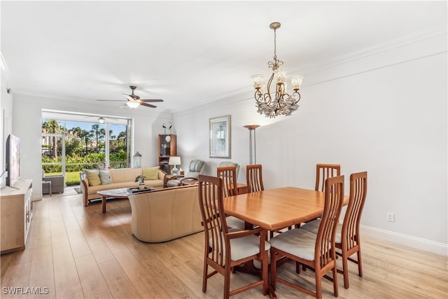 dining space featuring ceiling fan with notable chandelier, light hardwood / wood-style floors, and ornamental molding