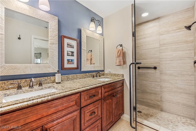 bathroom with vanity and an enclosed shower