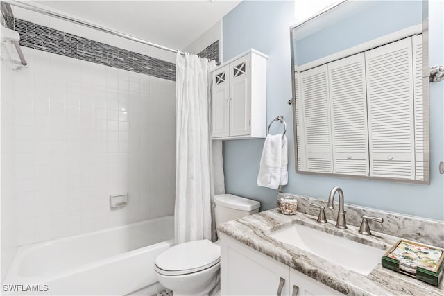 full bathroom with shower / tub combo, vanity, and toilet