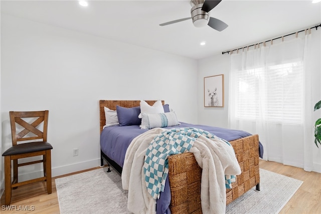 bedroom with light wood-type flooring and ceiling fan