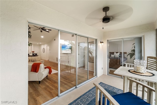 entryway featuring hardwood / wood-style flooring and ceiling fan