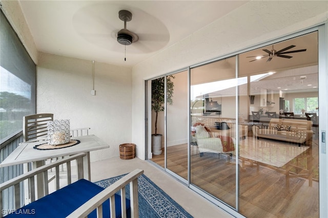 balcony featuring ceiling fan