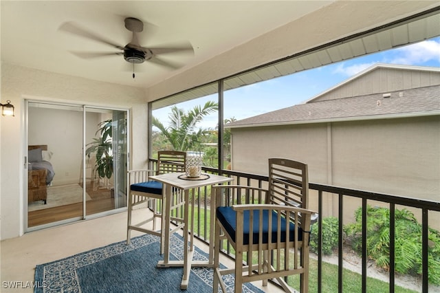 sunroom featuring plenty of natural light and ceiling fan