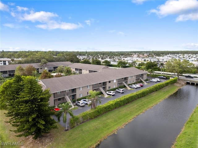 drone / aerial view with a water view