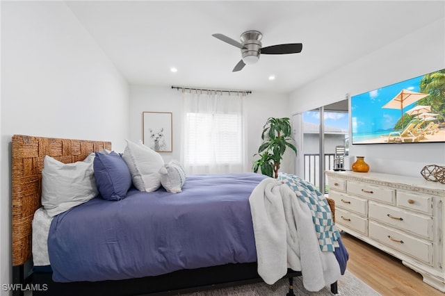 bedroom with ceiling fan and light wood-type flooring