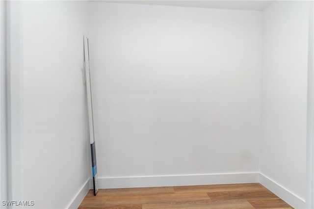 unfurnished room with light hardwood / wood-style floors