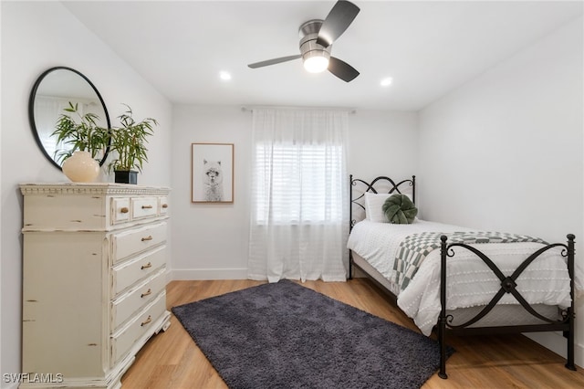 bedroom featuring light hardwood / wood-style floors and ceiling fan