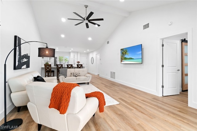 living room with beam ceiling, high vaulted ceiling, light hardwood / wood-style flooring, and ceiling fan