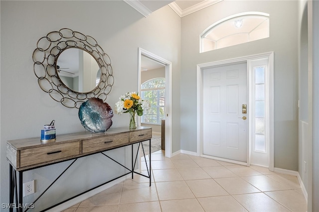 tiled entryway featuring ornamental molding