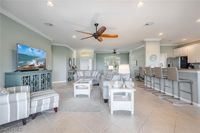 tiled living room featuring ceiling fan and crown molding