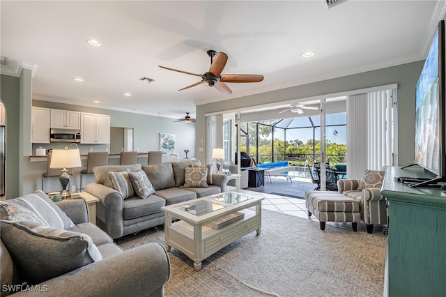 living room featuring light tile patterned floors and crown molding