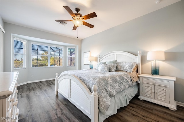 bedroom featuring ceiling fan and dark hardwood / wood-style flooring