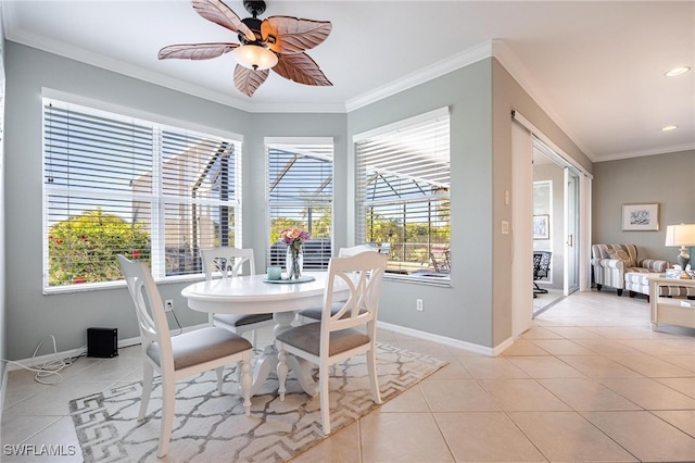 dining space featuring ceiling fan, light tile patterned floors, and ornamental molding