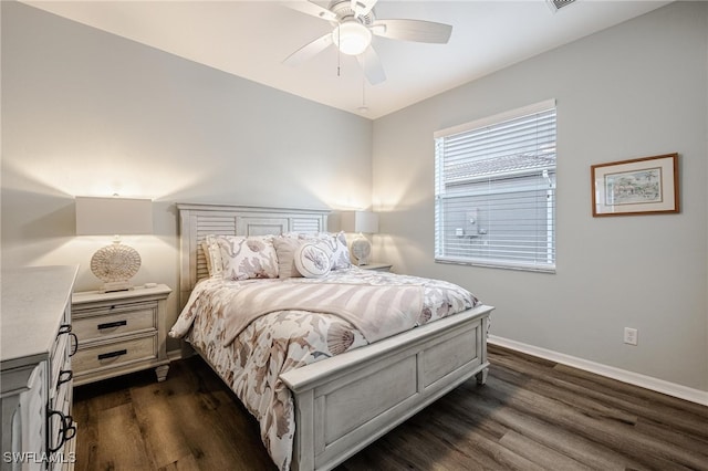 bedroom with ceiling fan and dark wood-type flooring