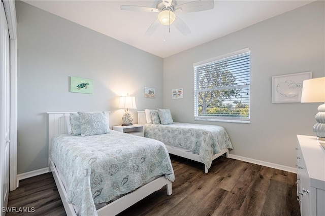 bedroom with ceiling fan and dark wood-type flooring