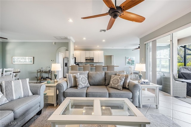 tiled living room featuring crown molding