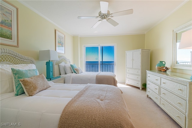 carpeted bedroom with access to exterior, ceiling fan, multiple windows, and ornamental molding