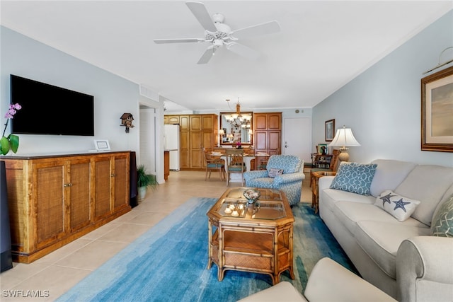 living room with ceiling fan with notable chandelier and light tile patterned flooring