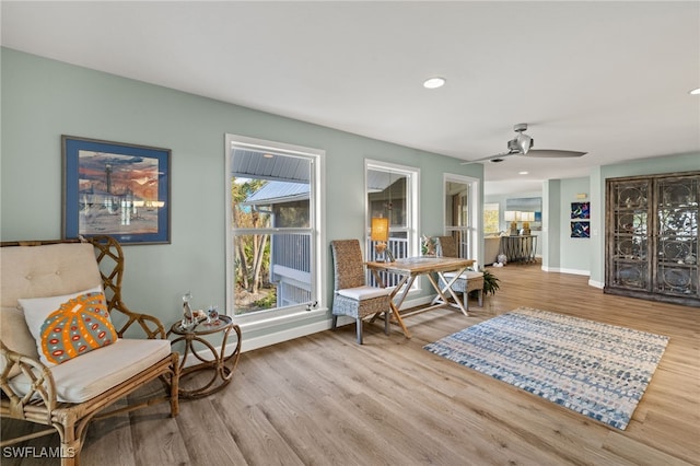 sitting room with recessed lighting, wood finished floors, a ceiling fan, and baseboards