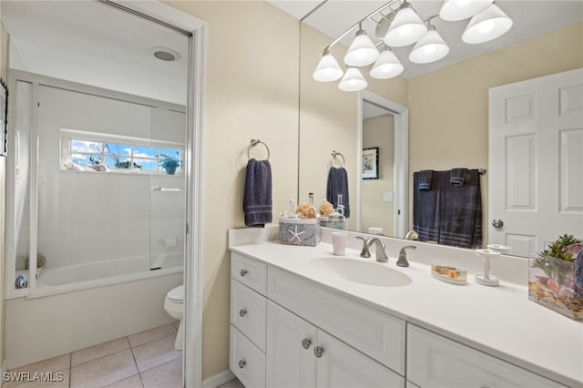 bathroom featuring toilet, bathtub / shower combination, tile patterned flooring, and vanity