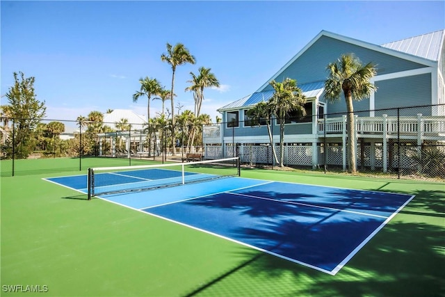 view of sport court with fence