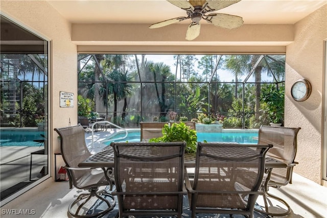 sunroom / solarium featuring ceiling fan and a wealth of natural light