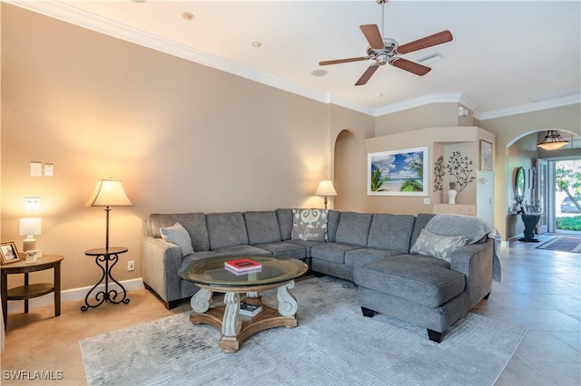 tiled living room featuring ceiling fan and crown molding