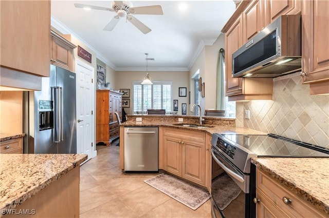 16144 Parque Ln, Naples, FL 34110 - kitchen with appliances with stainless steel finishes, a sink, backsplash, light stone countertops, and crown molding