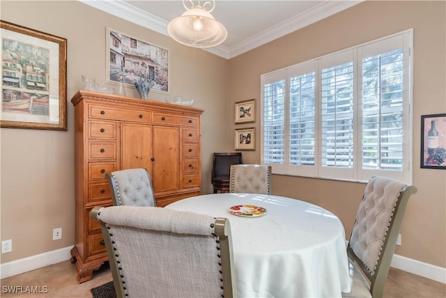 dining area featuring ornamental molding