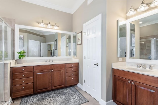 16144 Parque Ln, Naples, FL 34110 - bathroom with a stall shower, two vanities, ornamental molding, tile patterned flooring, and baseboards