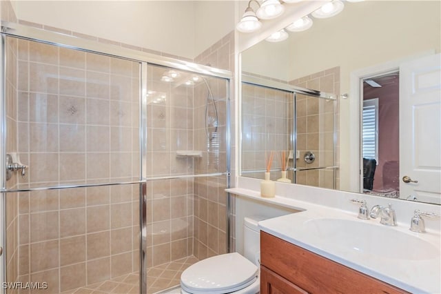 16144 Parque Ln, Naples, FL 34110 - full bath featuring toilet, vanity, and a stall shower