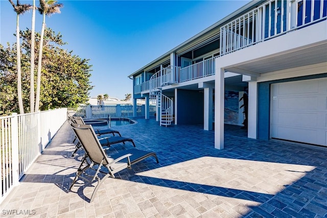 view of patio with a swimming pool