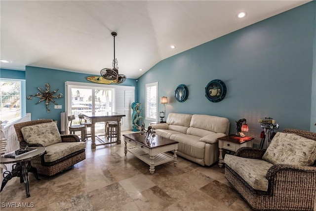 living room featuring vaulted ceiling