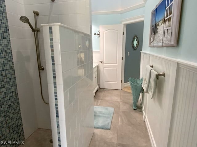 bathroom featuring a tile shower and tile patterned floors