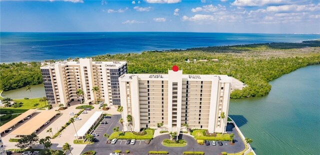 birds eye view of property with a water view